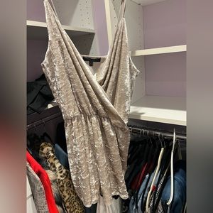 Cream colored romper. Size medium. Never worn!